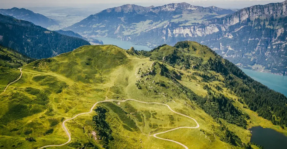 Aerial view of mountains in Flumserberg, Flums, Switzerland with trails and lake in the background